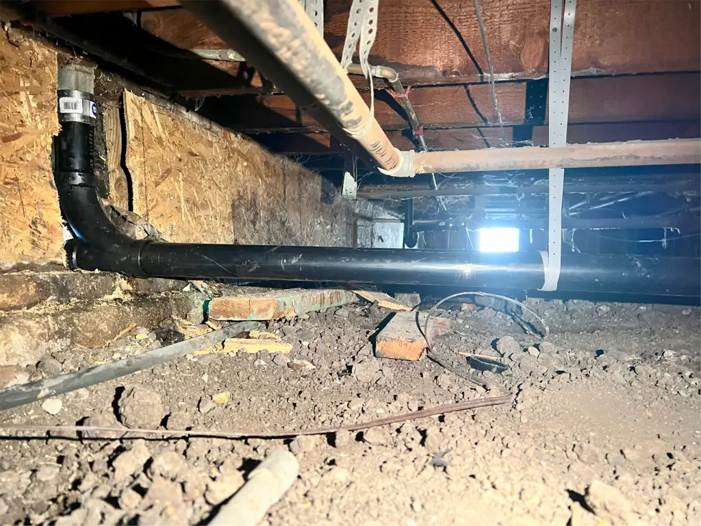 Redrain under house for kitchen drain